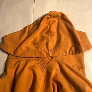 Gold crop top sweater with long sleeves and beautiful stitching